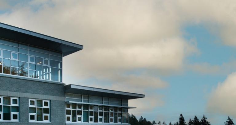 Scenic photo of a building on campus on a cloud day