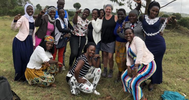 Group-of-Ugandan-women-with-researcher