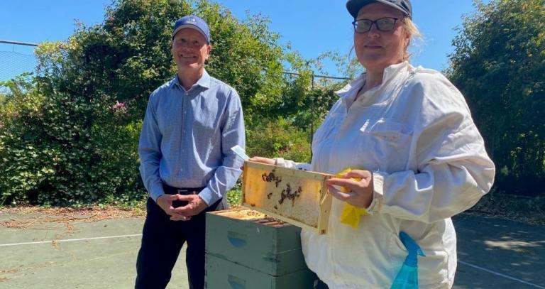 {President Philip Steenkamp and Beekeeper Alanna Morbin
