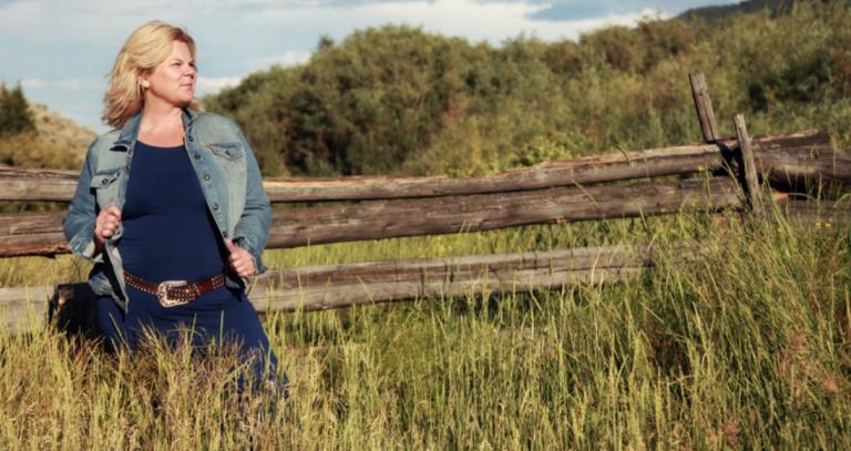 Robyn Grebliunas FNTC, standing next to a fence in a field