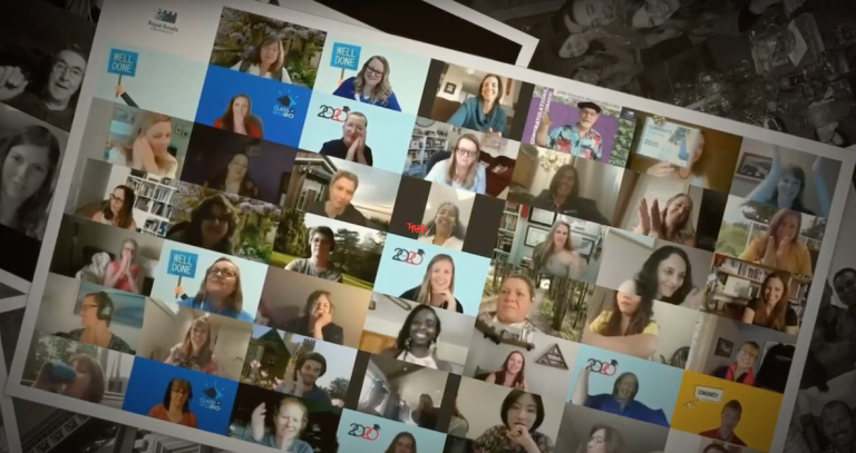 A nostalgic looking photograph of a zoom screen full of cheering graduates.