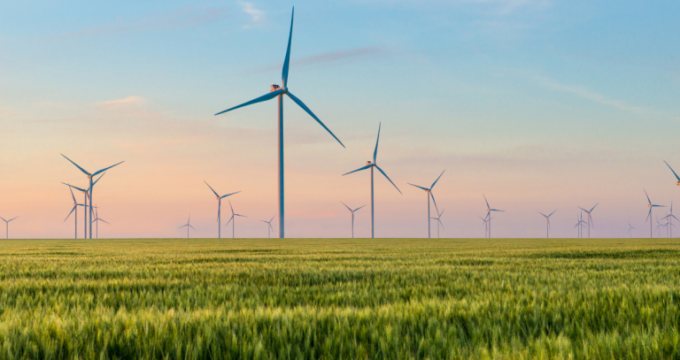 Windmills standingin a field