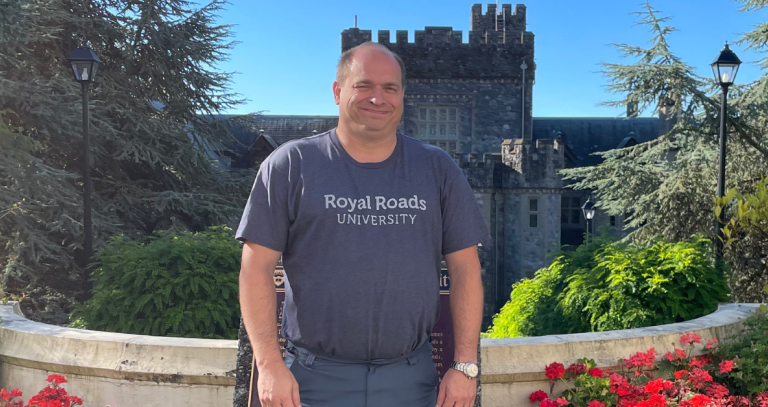 Dan Morris poses in front of Hatley Castle