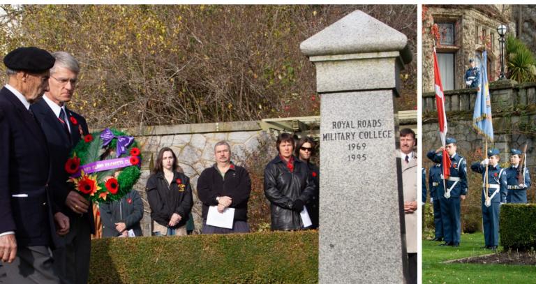 Two veterans carry a wreath toward a cenotaph during a Remembrance Day ceremony.