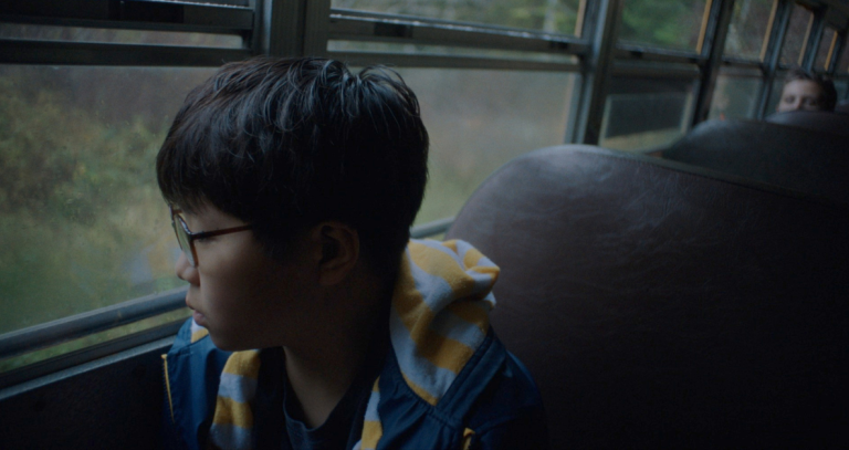 A boy looks out the window of a school bus in this film grab from student Arnold Lim's new short, "My Name is Arnold."