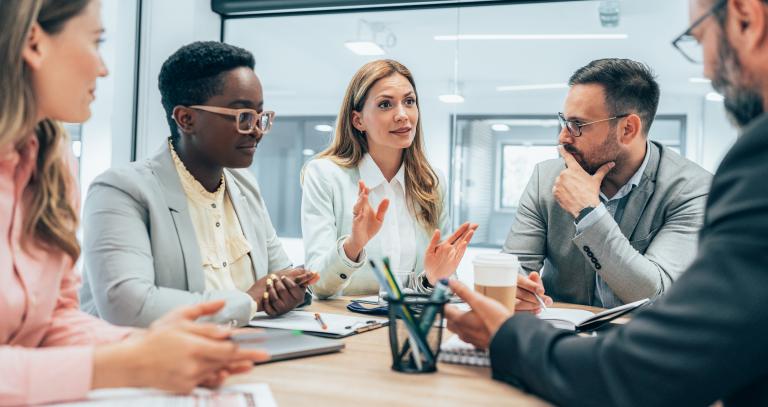 A group of people having a business meeting.