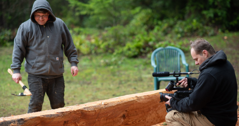 Prof. Vannini films carver Beau Wagner as he works on a dug out canoe.