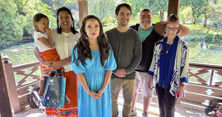 The graduates and faculty members in the Japanese Gardens at Royal Roads.