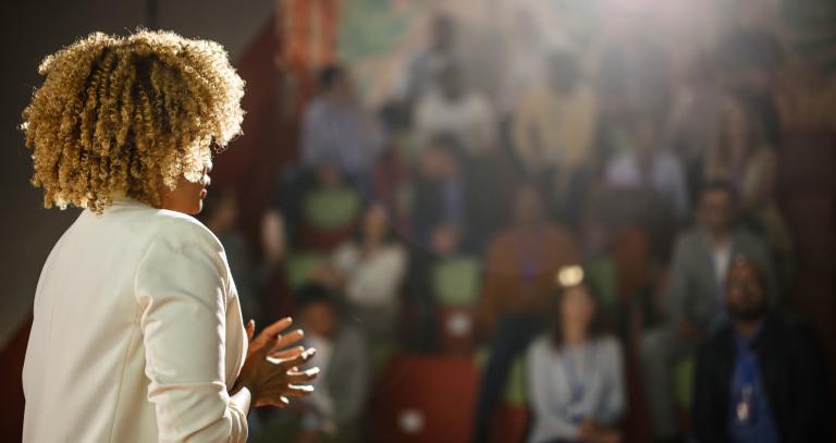 Female addressing an audience