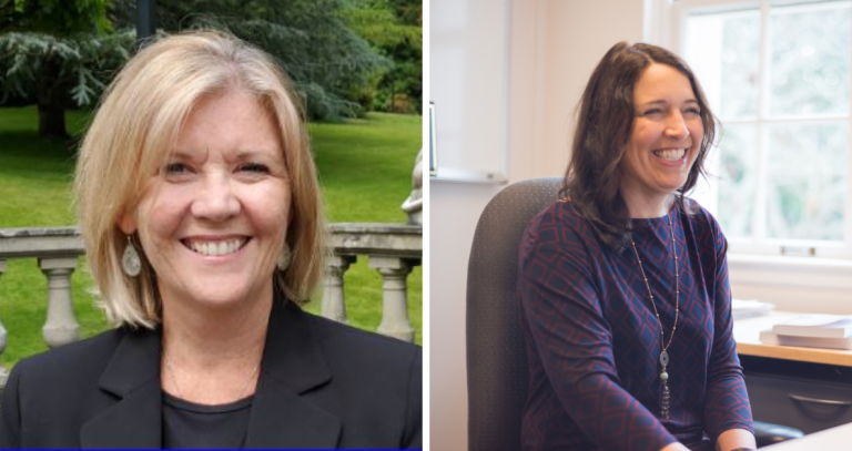 Portraits of two women. Woman on the left has short blonde hair and smiling directly to camera. Woman on the right has long brunette hair and is smiling at her computer monitor.