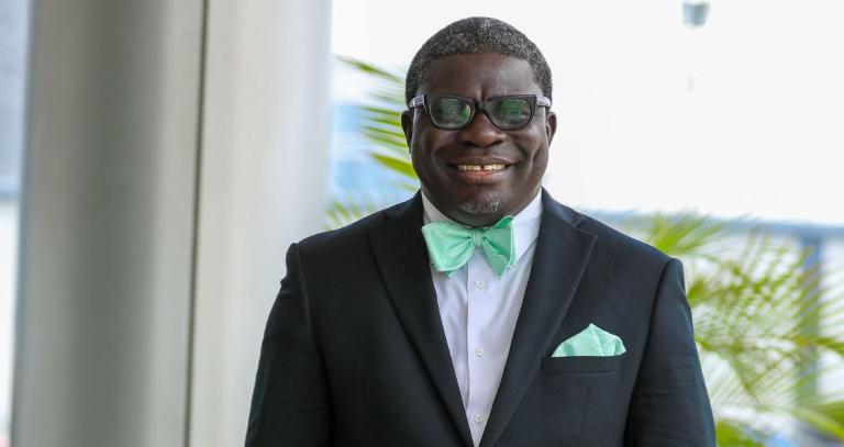 Edward Appiah-Brafoe wearing a tux and smiling outside