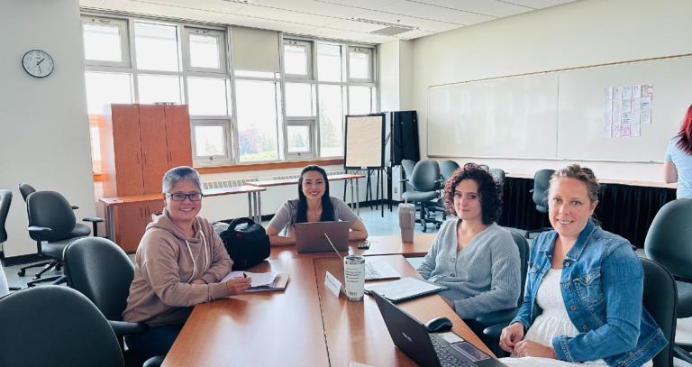 Jessie Zhang and classmates sitting at desks.