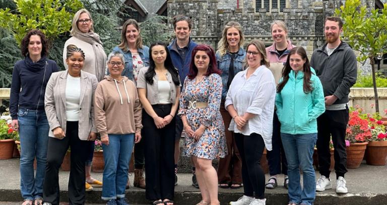 Master of Arts in Professional Communication students standing in front of Hatley Castle.