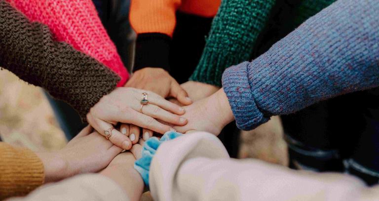 hands together in circle of unity