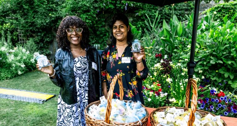 Janet Befo, Sarjina Hossain Trima stand next to each other in the Royal Roads gardens.
