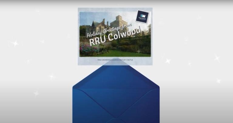 A postcard flies out of an envelope surrounded by sparkles, it says Holiday Greetings from RRU Colwood