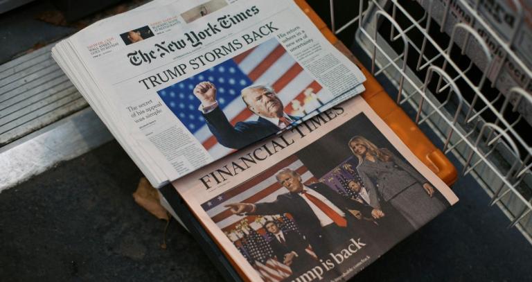 New York Times newspaper displays "Trump storms back" on front page headline.