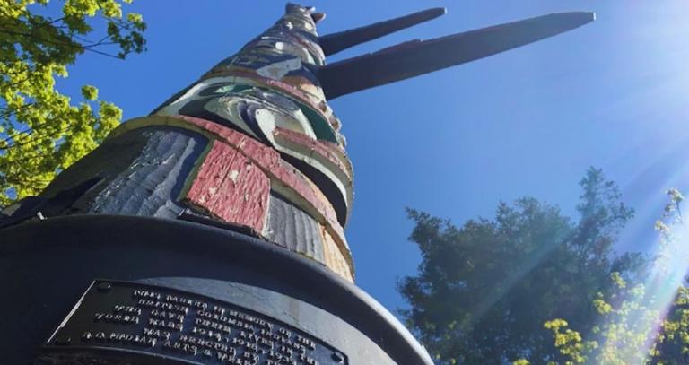 An image of a totem pole, taken from the base of the pole