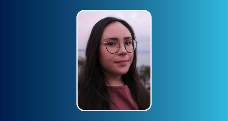 Jasmine Dionne smiling in front of a natural background