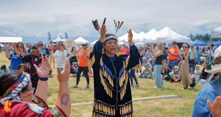 Crowds gather to watch a performer during NIPD celebrations at Royal Roads University
