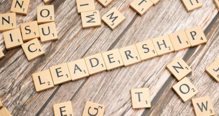 Wooden letter tiles spelling "leadership"