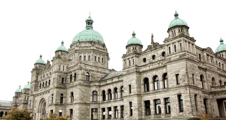 The BC Legislature on a cloudy day from a side angle