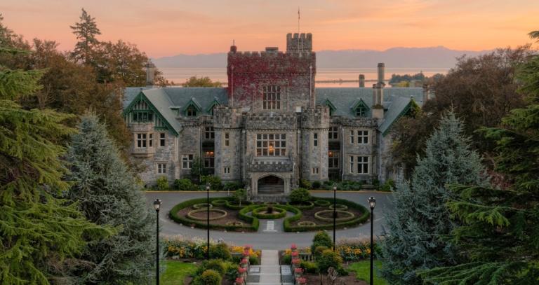 Hatley Castle with a sunrise in the background