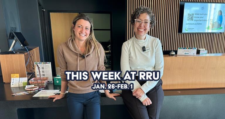 Two women standing in front of connection desk