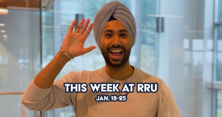 Man wearing a turban waving and smiling