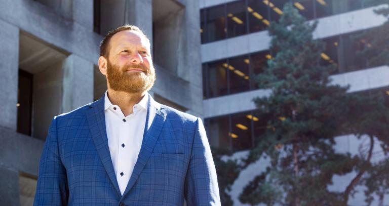 Trevor Koot standing outside an office building
