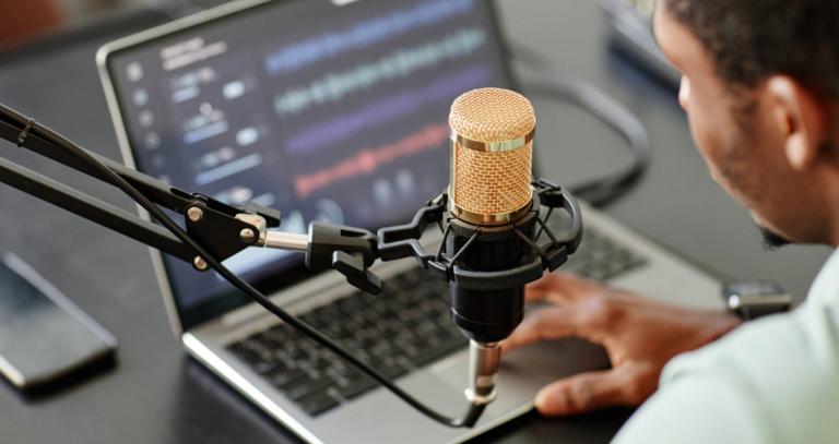 High angle close up of African-American man recording podcast 