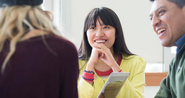 students smiling in class