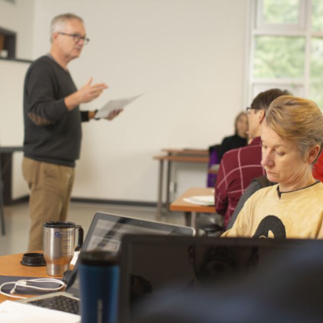 Instructor in classroom of students