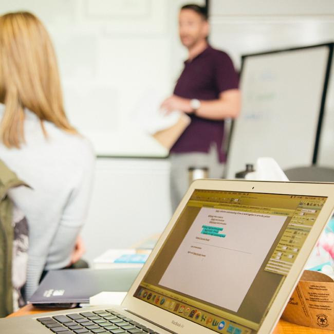 Instructor-talking-in-front-of-whiteboard