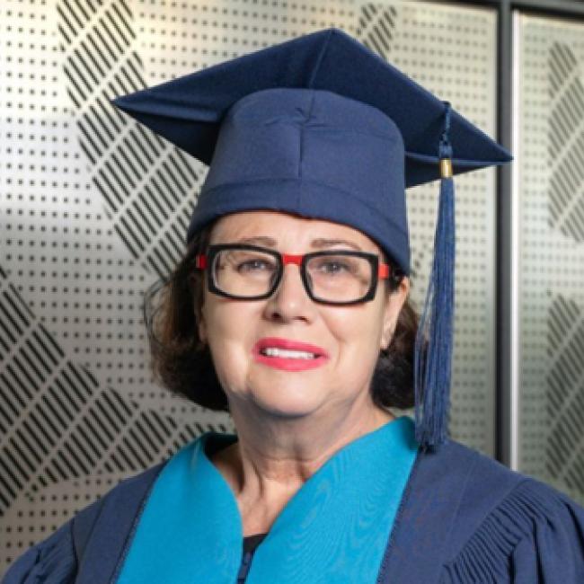 Janet Austin wearing convocation cap and gown