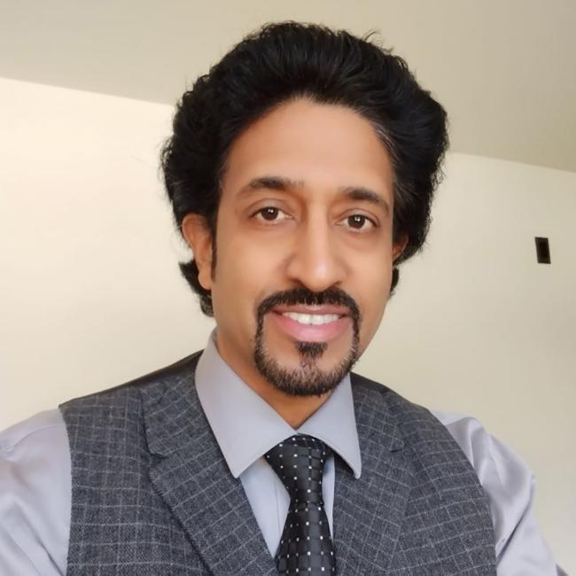 Portrait of Raaj, a professor at Royal Roads University