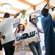 Students-at-orientation-days-with-Indigenous-masks-and-robes