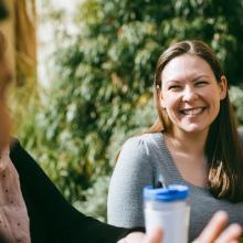 Smiling-student-outside-with-water-bottle