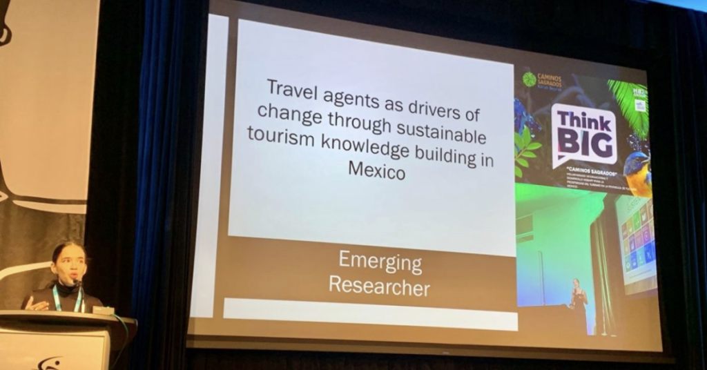 Veronica Santiago speaks at the podium during the IMPACT Sustainability Travel and Tourism conference
